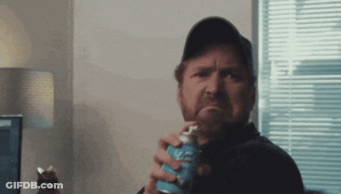 Man In Baseball Cap Holding Soda GIF