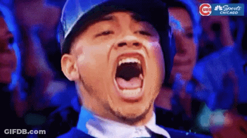 Man In Baseball Cap Screaming In Crowd GIF