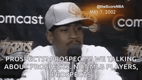 Man In Baseball Cap Talking Into Microphone GIF