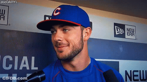 Man In Baseball Cap Talking Into Microphone GIF