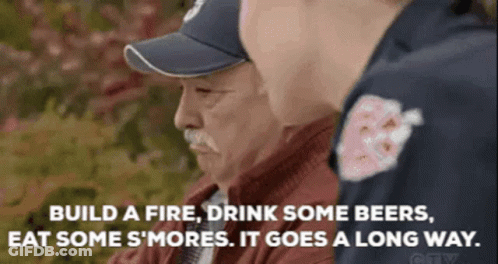 Man In Baseball Cap Talking To Man In Red Jacket GIF