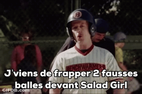 Man In Baseball Helmet And Jersey Standing In Front Of A Fence GIF