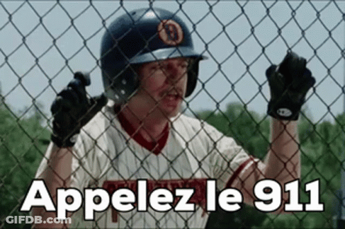 Man In Baseball Uniform Behind Fence Appelez Le 911 GIF