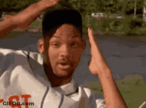 Man In Baseball Uniform Hands In Air At Lake GIF