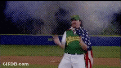 Man In Baseball Uniform Holding American Flag GIF