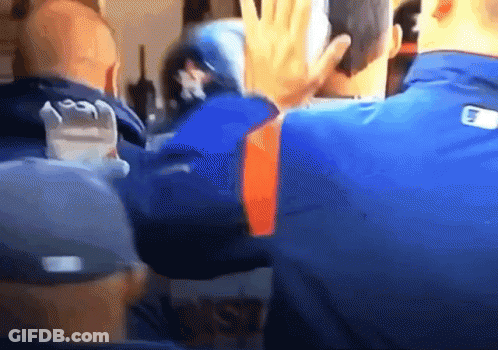 Man In Baseball Uniform Holding Baseball At Fence GIF