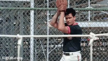 Man In Baseball Uniform Holding Baseball GIF