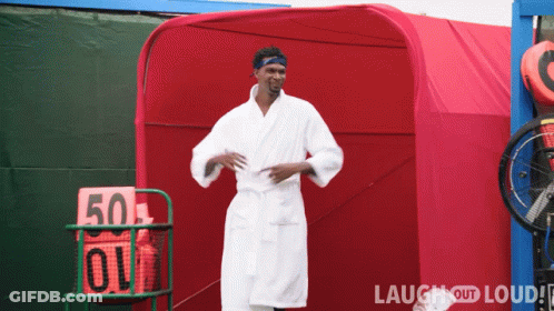 Man In Bathrobe In Front Of Red Tent Number 50 GIF