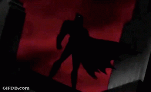 Man In Batman Costume Holding Soda Can GIF