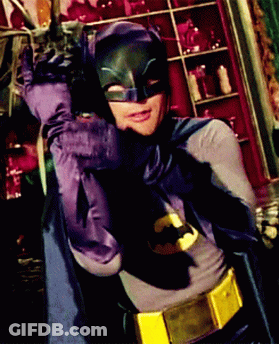 Man In Batman Costume Holding Sword GIF