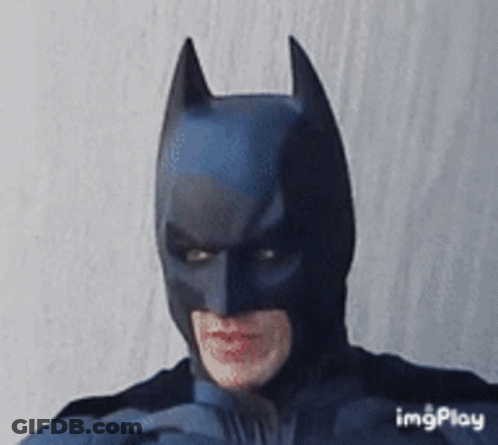 Man In Batman Costume Making A Face GIF