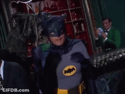 Man In Batman Costume Making Heart With Hands GIF