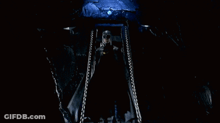 Man In Batman Costume With Yellow Bat Symbol GIF