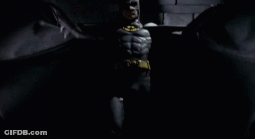 Man In Batman Costume With Yellow Bat GIF