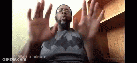 Man In Batman Shirt And Glasses Making Funny Face GIF