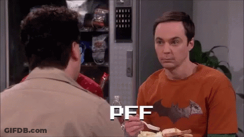 Man In Batman Shirt Eating Chips Talking To Another Man GIF