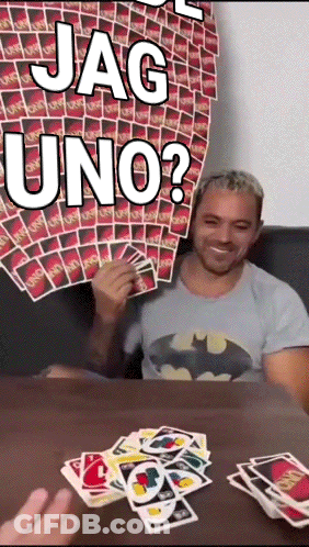 Man In Batman Shirt Playing Card Game GIF