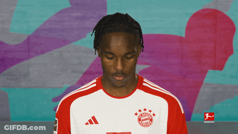 Man In Bayern Munich Jersey Looking Down GIF