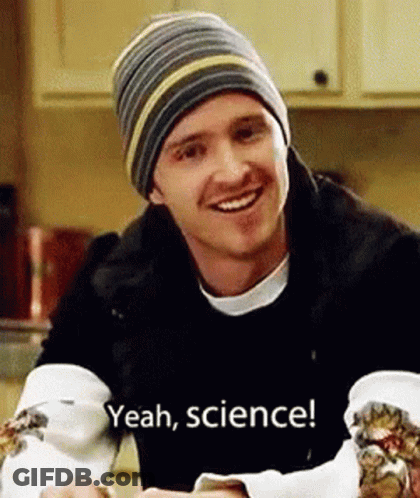 Man In Beanie And Black Jacket Smiling Holding Food GIF