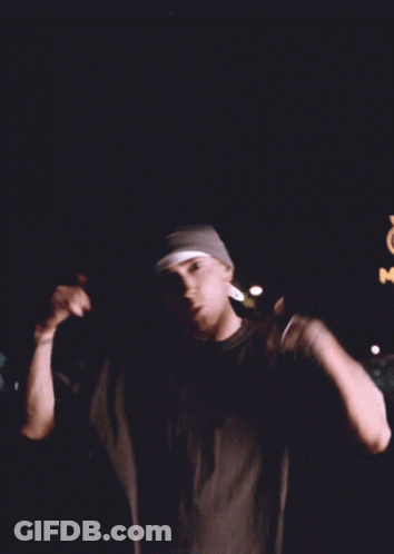 Man In Beanie And Black Shirt In Front Of McDonald's Sign GIF