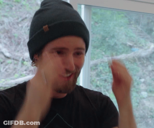 Man In Beanie And Black Shirt Making A Face GIF