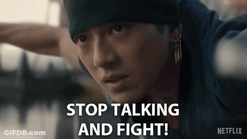 Man In Beanie And Earrings Says Stop Talking And Fight GIF