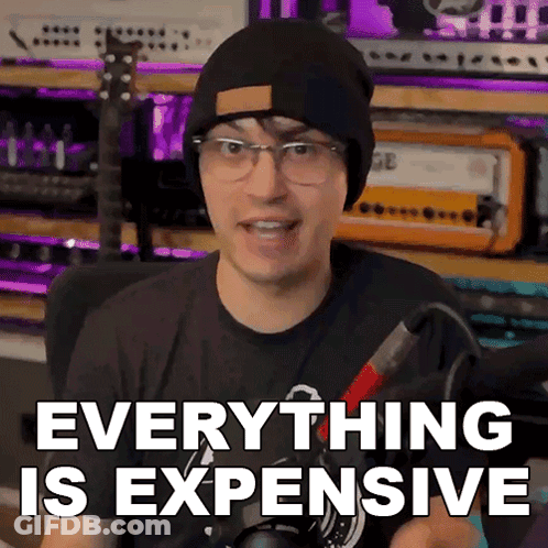 Man In Beanie And Glasses Says Everything Is Expensive GIF