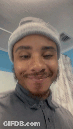 Man In Beanie And Gray Shirt Smiling GIF