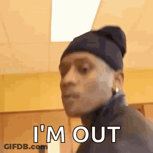 Man In Beanie And Jacket Making Funny Face Saying I'm Out GIF