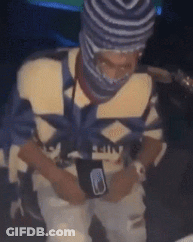 Man In Beanie And Mask Sitting GIF