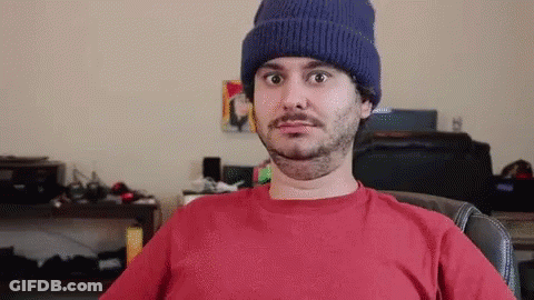 Man In Beanie And Red Shirt Sitting In Chair GIF
