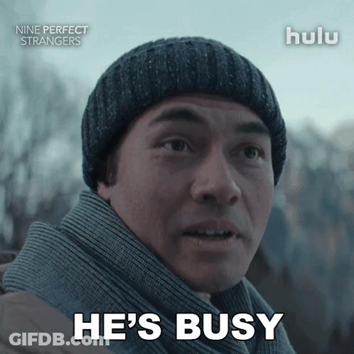 Man In Beanie And Scarf Says He's Busy GIF