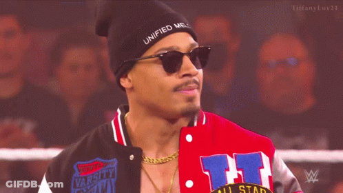 Man In Beanie And Sunglasses Standing In Wrestling Ring GIF