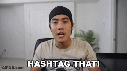 Man In Beanie And T-Shirt Saying Hashtag That GIF