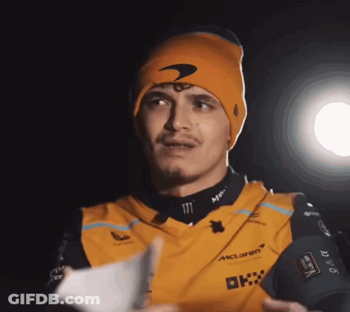 Man In Beanie Holding Paper GIF