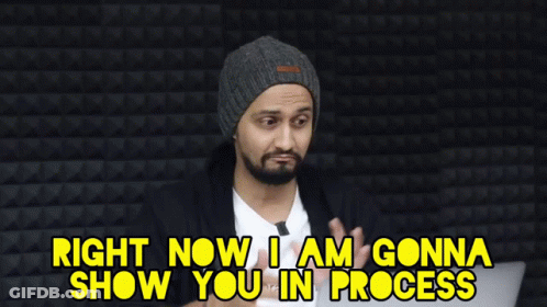 Man In Beanie Saying In Progress GIF