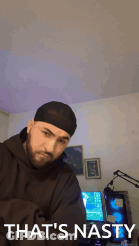 Man In Beanie Saying That's Nasty In Front Of Computer GIF