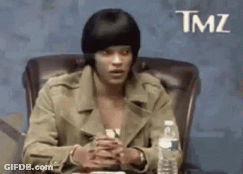 Man In Beanie Sitting With Water GIF