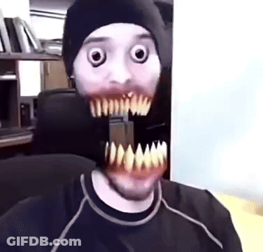 Man In Beanie With Monster Mouth Mask GIF