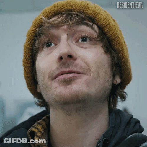 Man In Beanie With Resident Evil Text GIF