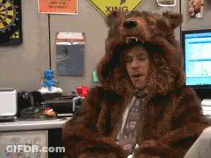 Man In Bear Costume Sitting At Computer GIF