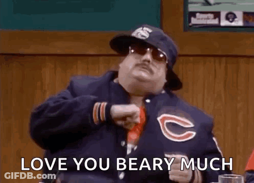 Man In Bear Jacket And Hat At Table GIF