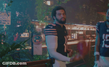 Man In Bear Jersey Next To Man In Number 15 Jersey GIF