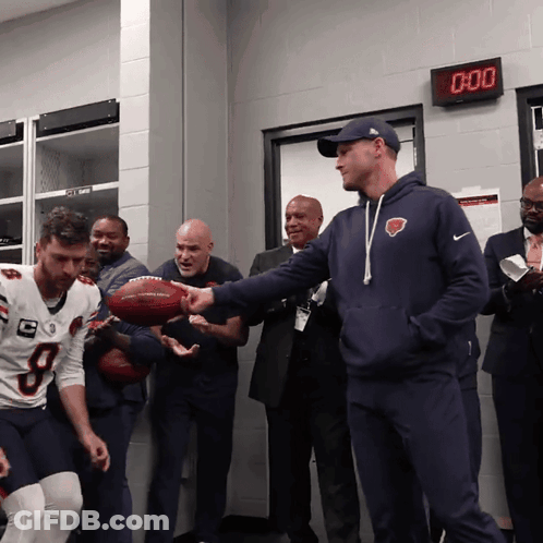 Man In Bear Sweatshirt Holding Football At 0:00 Clock GIF