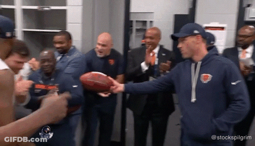 Man In Bear Sweatshirt Shaking Hands With Football Player GIF