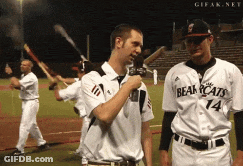 Man In Bearcats Jersey Holding Microphone GIF