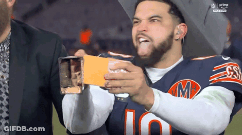 Man In Bears Jersey Holding Card GIF