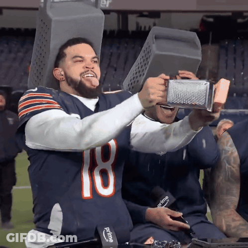 Man In Bears Jersey Holding Grater On Head GIF