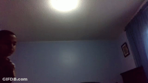 Man In Bedroom With Ceiling Light GIF