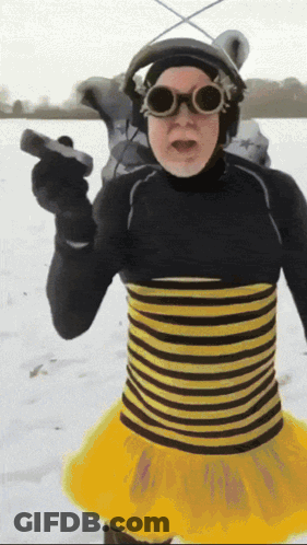 Man In Bee Costume Holding Gun GIF